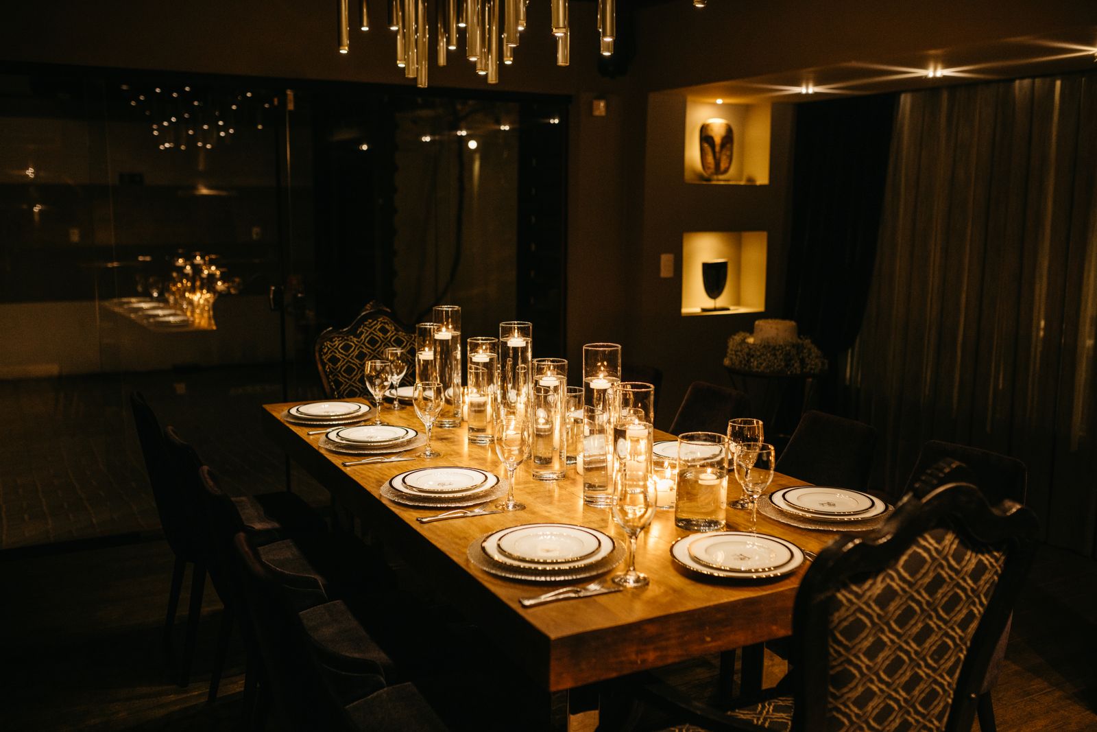 Dinner table lit by candles