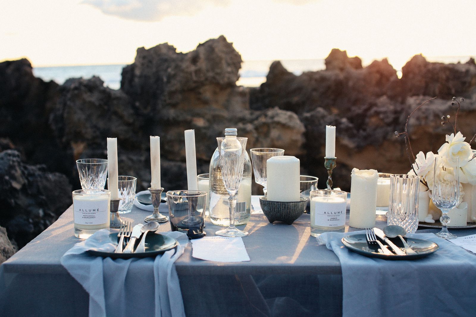 Table setting with white pillar candles